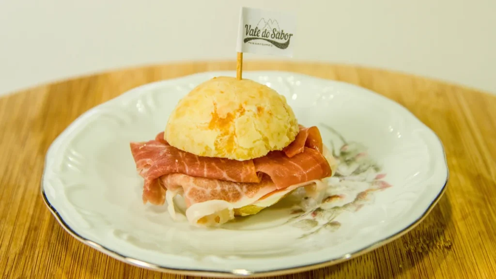 Brazilian cheese bread (pão de queijo) stuffed with Parma ham